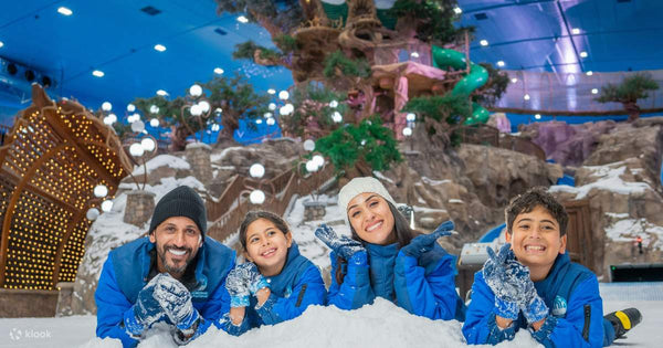 Family enjoying themselves at Snow Abu Dhabi, an indoor snow park located in Abu Dhabi