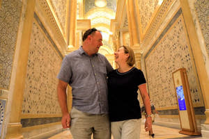 Couple inside interior of the Sheikh Zayed Grand Mosque