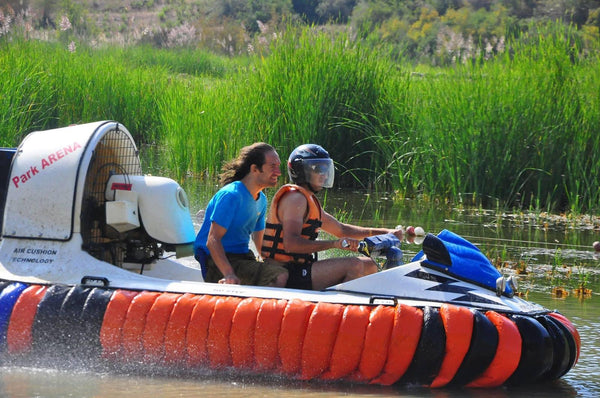 People driving Hovercraft