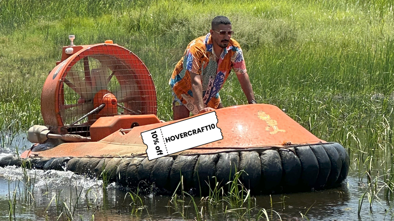 Man driving hovercraft in water