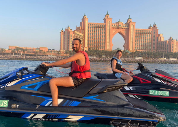 enjoying a jet ski ride in Dubai, with the iconic Atlantis, The Palm resort