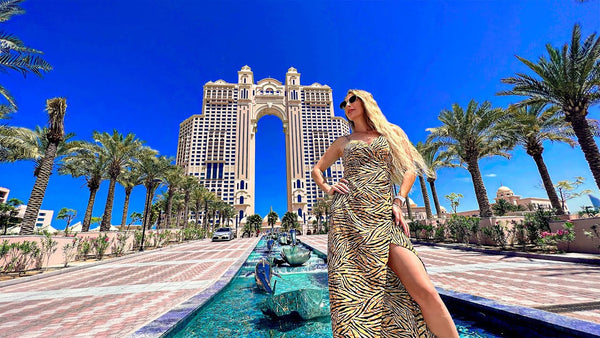 Model photoshoot in front of The Palm, an iconic destination resort