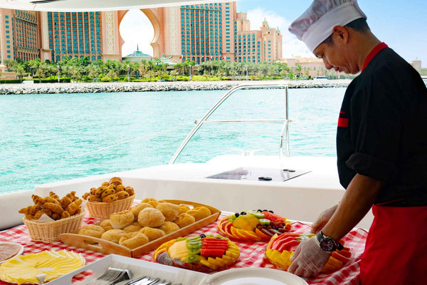 Chef preparing a meal on a yacht during a cruise in Dubai