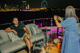Girl taking photo of a boy