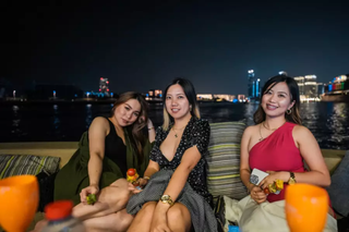 Three girls sitting on a sofa