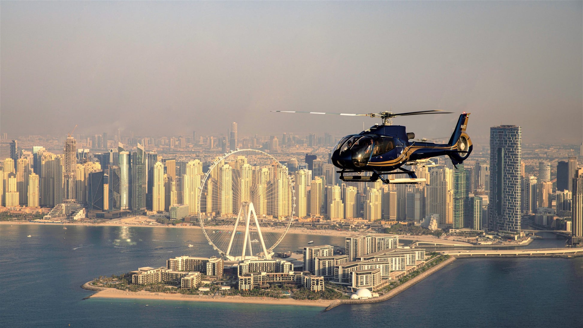 The prominent Ferris wheel in the foreground is Ain Dubai, one of the world's largest and a significant landmark in Dubai. 