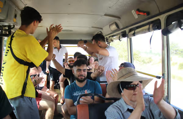 People having a good time in the bus