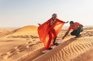 sandboarding, a popular activity offered during a desert safari experience in Dubai. 