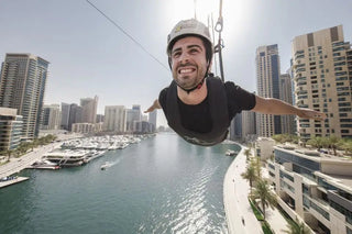 Man Enjoying Zip Line Across The Marina 