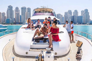 Luxury yacht tour in Dubai, likely cruising through the Dubai Marina with the city skyline