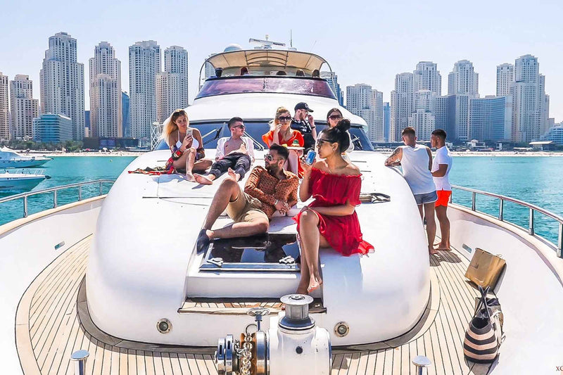 Luxury yacht tour in Dubai, likely cruising through the Dubai Marina with the city skyline