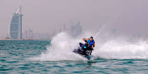 Man riding jet ski at Burj Al Arab