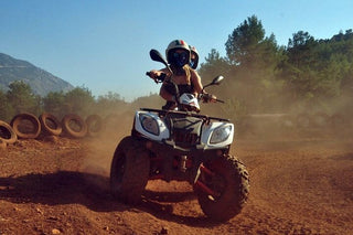 People riding ATV Quad in dirt