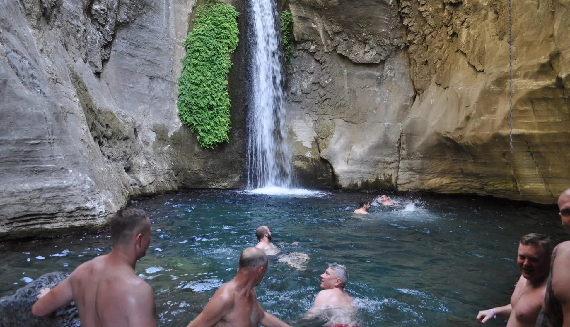 Men swimming in the Sapadere Canyon Waterfall 

