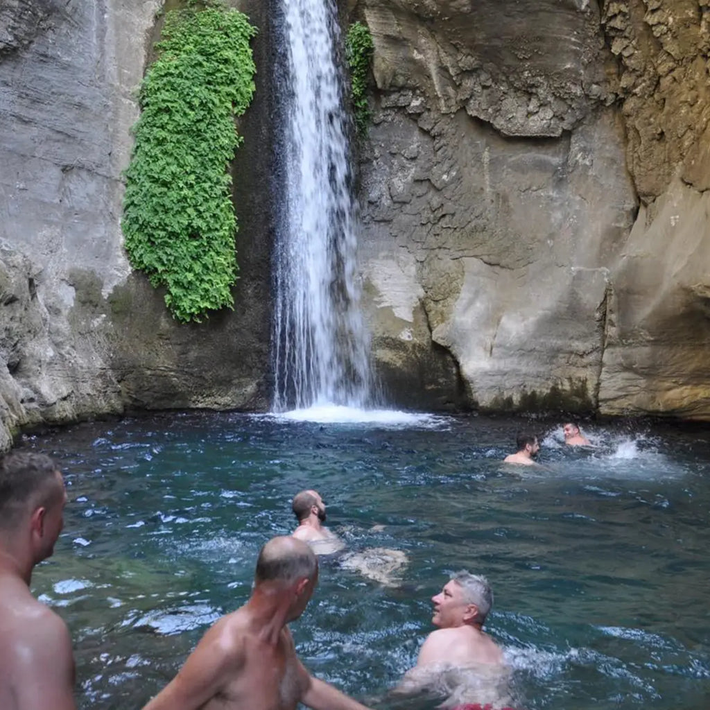 Men swimming in the Sapadere Canyon Waterfall 
