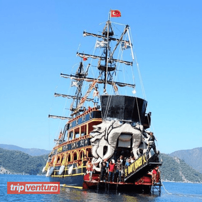 Grand pirate-themed boat cruising on the turquoise waters of the Mediterranean Sea near Alanya.