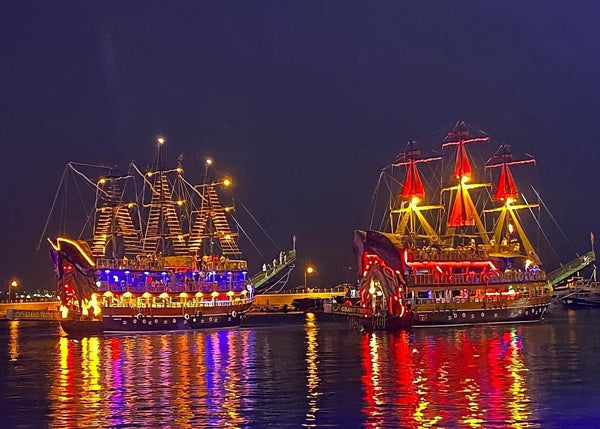 Boats cruising during sunset