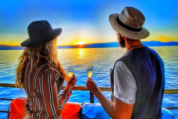 Couple enjoying sunset view from a boat
