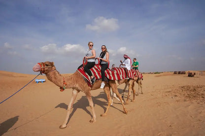 Guests are enjoying Camel riding During their desert safari tour