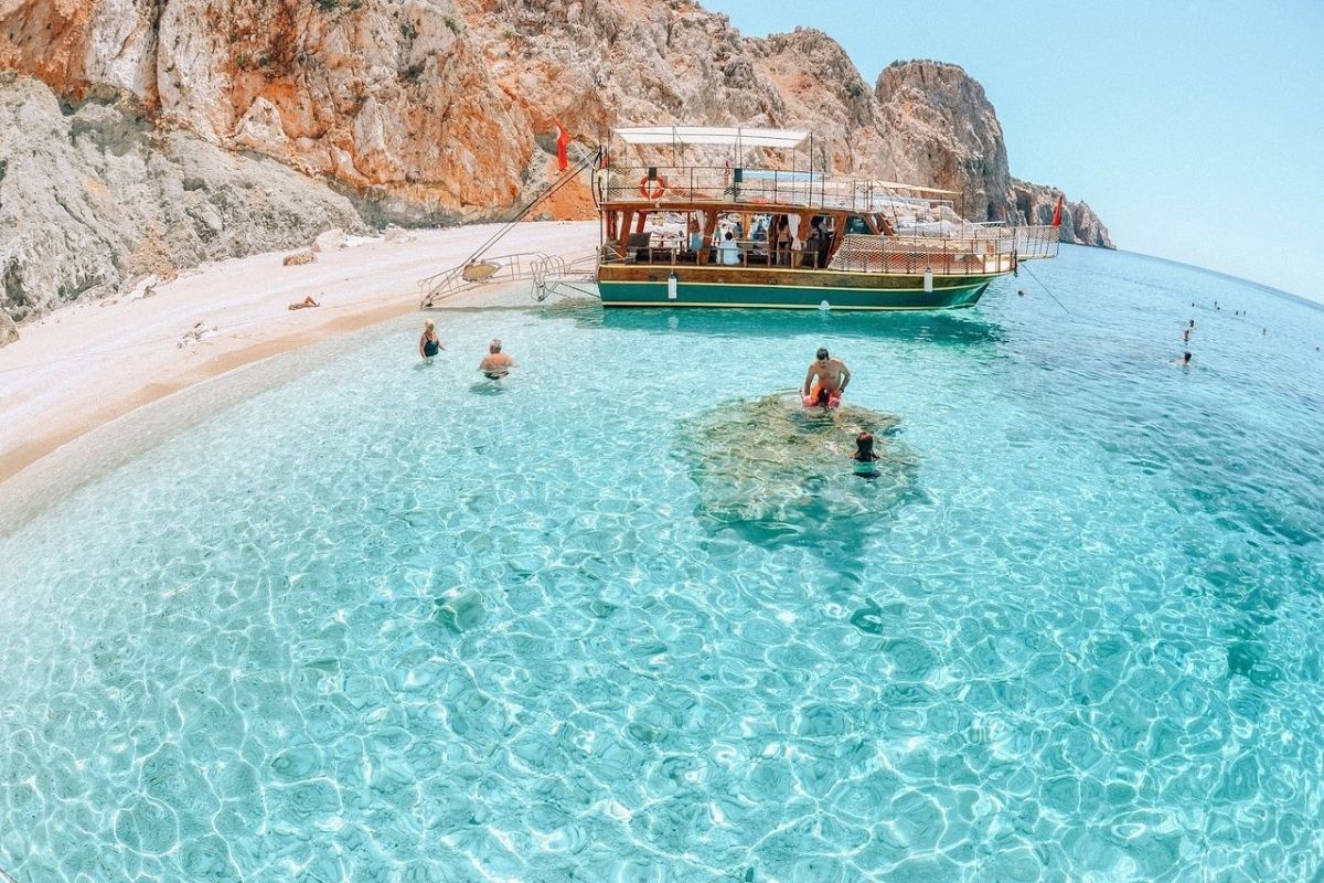 Pirate boat passing near a famous sea cave along the Alanya coastline