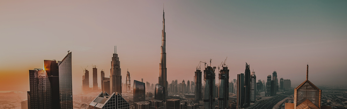 City skyline with modern skyscrapers at sunset