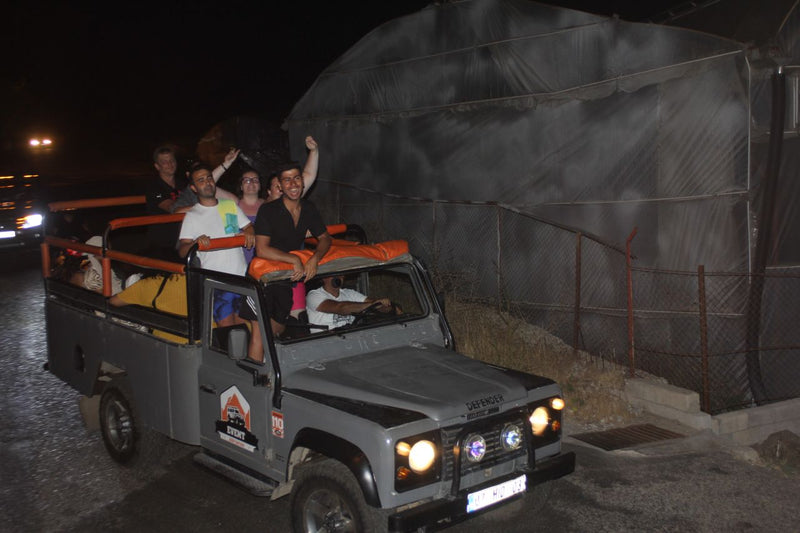 People riding Jeep at night