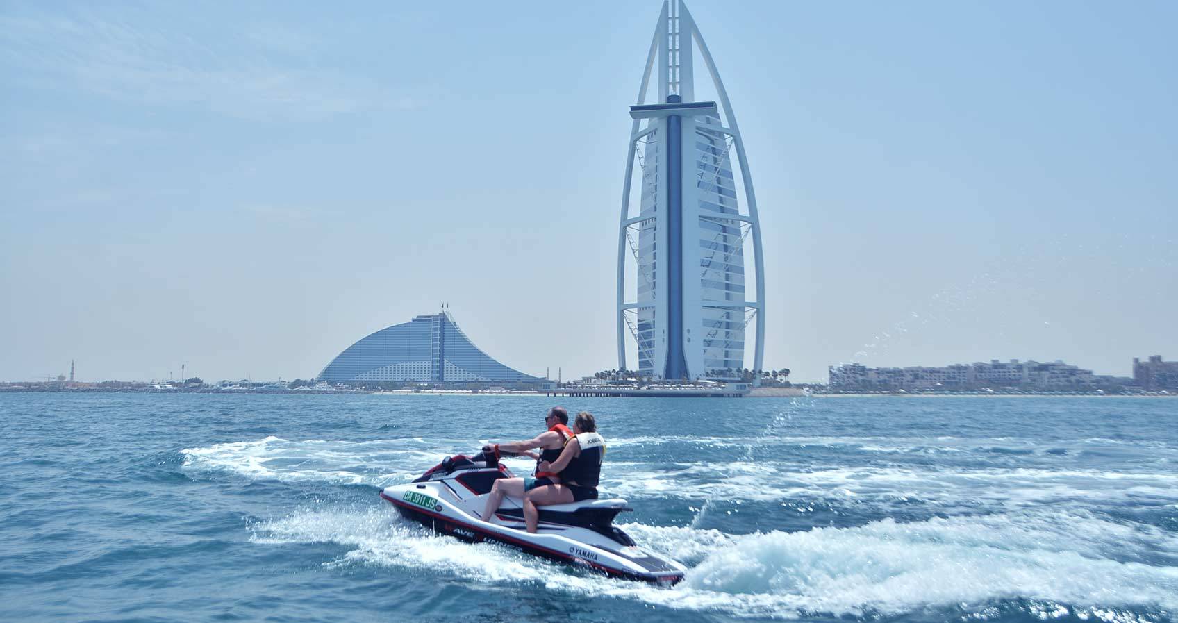 Couple enjoying a jet ski tour in Dubai