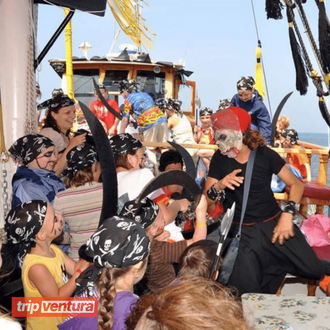 Children participating in pirate-themed games and activities onboard the boat