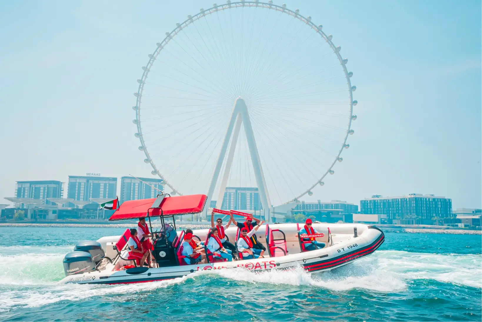 Love Boats" speed boat tour in Dubai, with the iconic Ain Dubai Ferris wheel