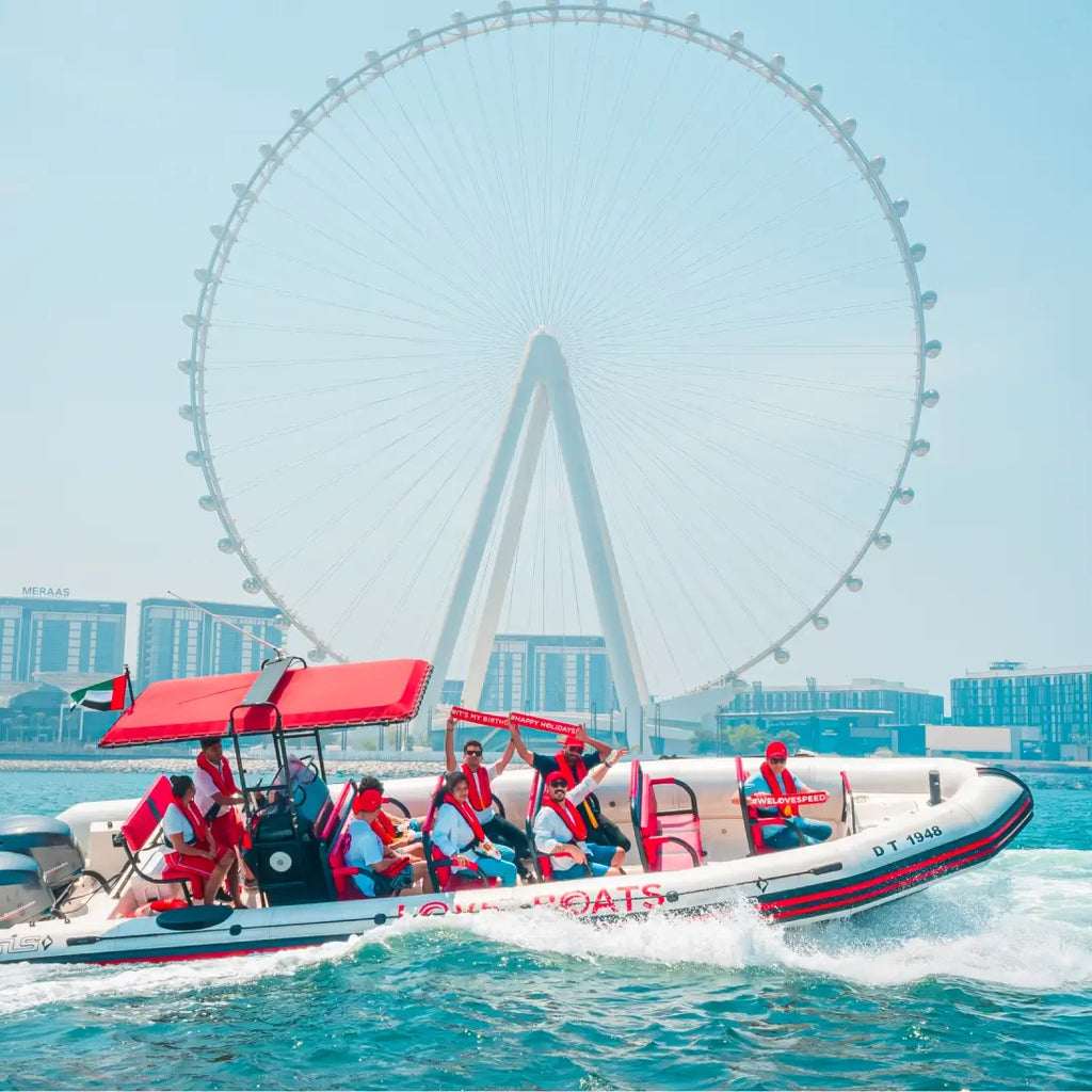 Love Boats" speed boat tour in Dubai, with the iconic Ain Dubai Ferris wheel
