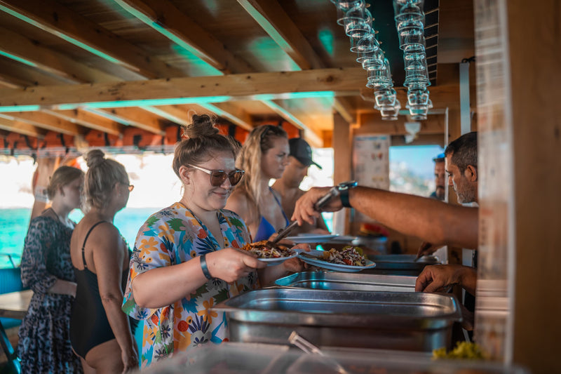 Guests having lunch on a boat