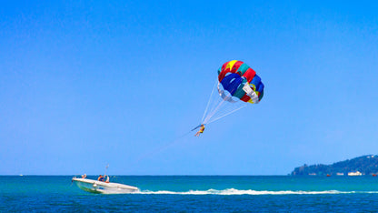 Parasailing sea boat blue sky island
