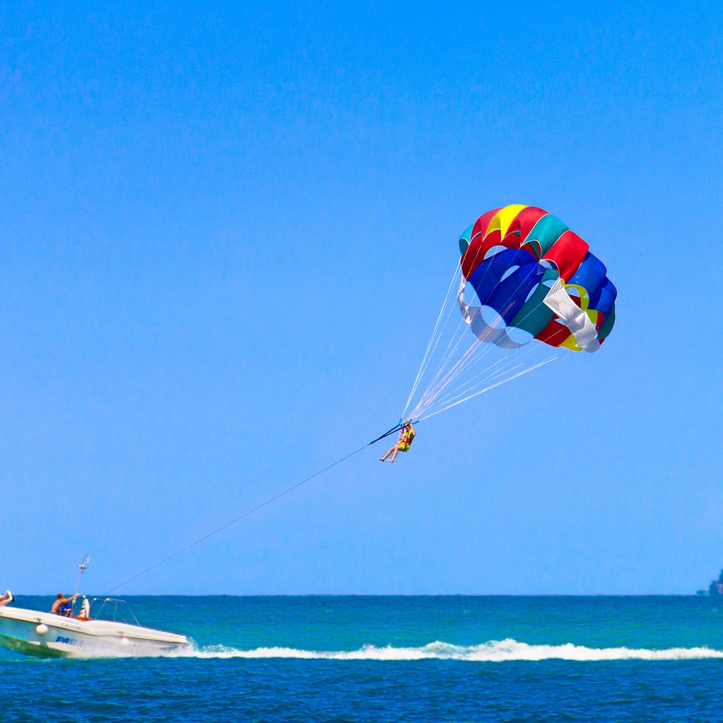 Parasailing sea boat blue sky island