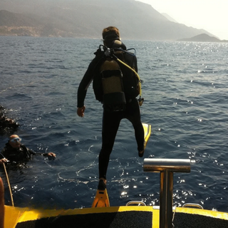 Man jumping in the river for scuba diving