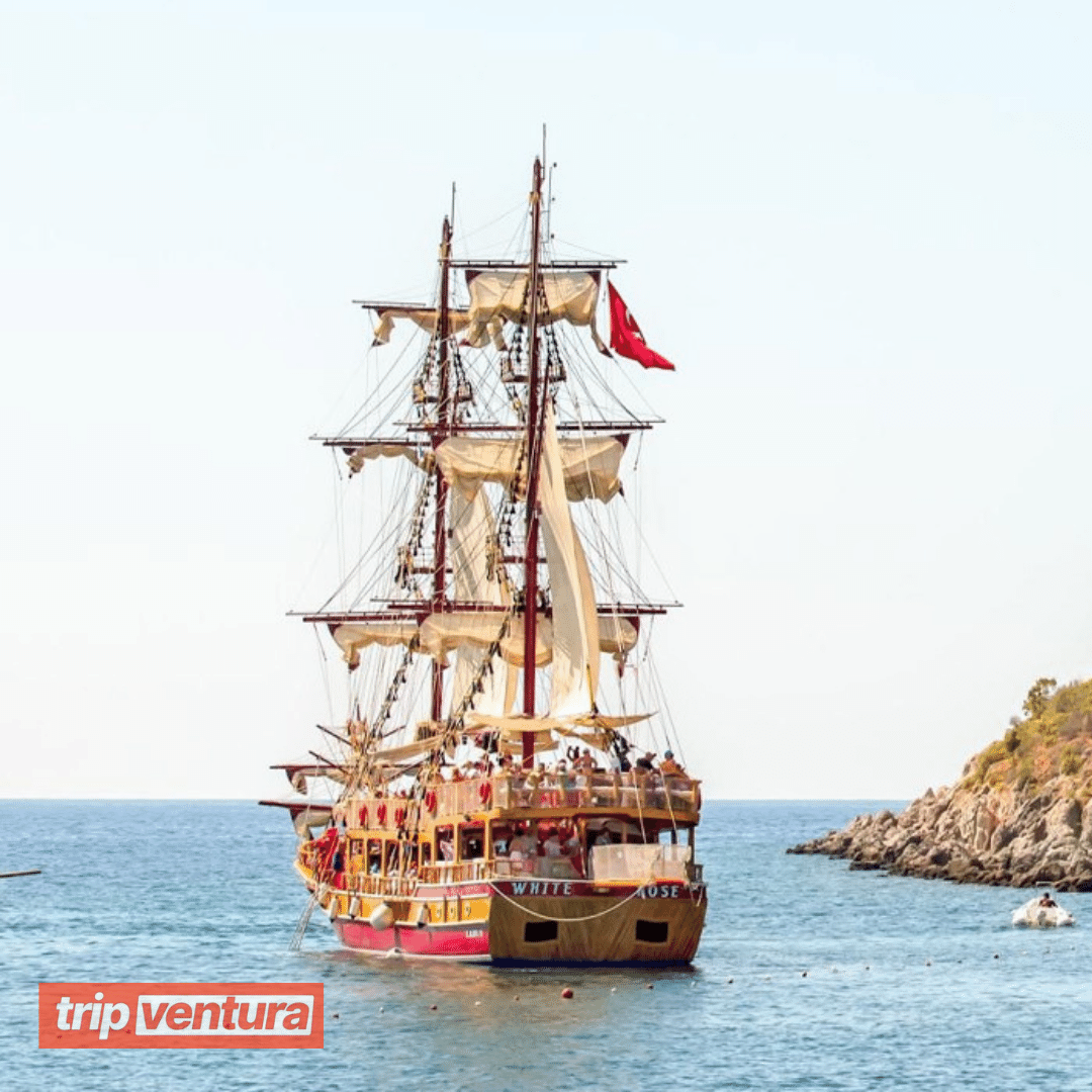 Tourists swimming near a picturesque cove during the pirate boat tour