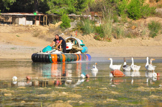 People driving Hovercraft