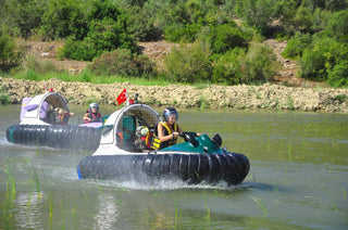 People driving Hovercraft