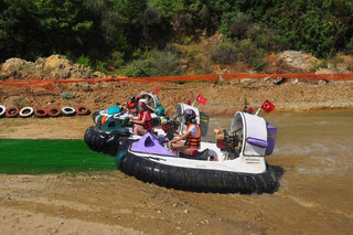 People driving Hovercraft