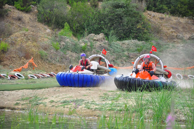People driving Hovercraft