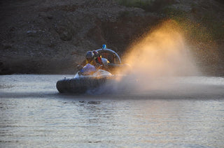 People driving Hovercraft