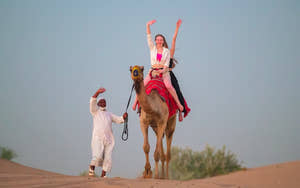 Girls riding Camel