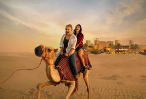 Girls riding camel