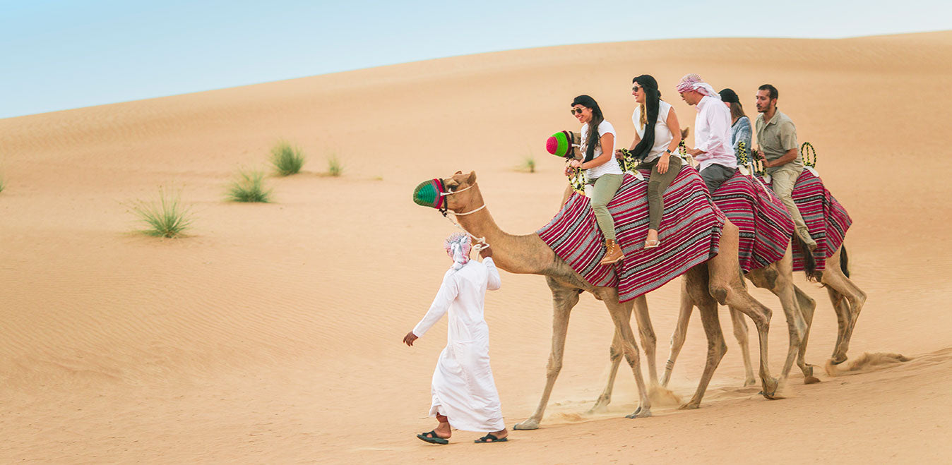 Dubai Premium Desert Safari , Dune Bashing, Sandboarding, Camel Riding, Entertainment Shows and Live Cooking Station - Tripventura