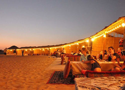 Dubai Premium Desert Safari , Dune Bashing, Sandboarding, Camel Riding, Entertainment Shows and Live Cooking Station - Tripventura