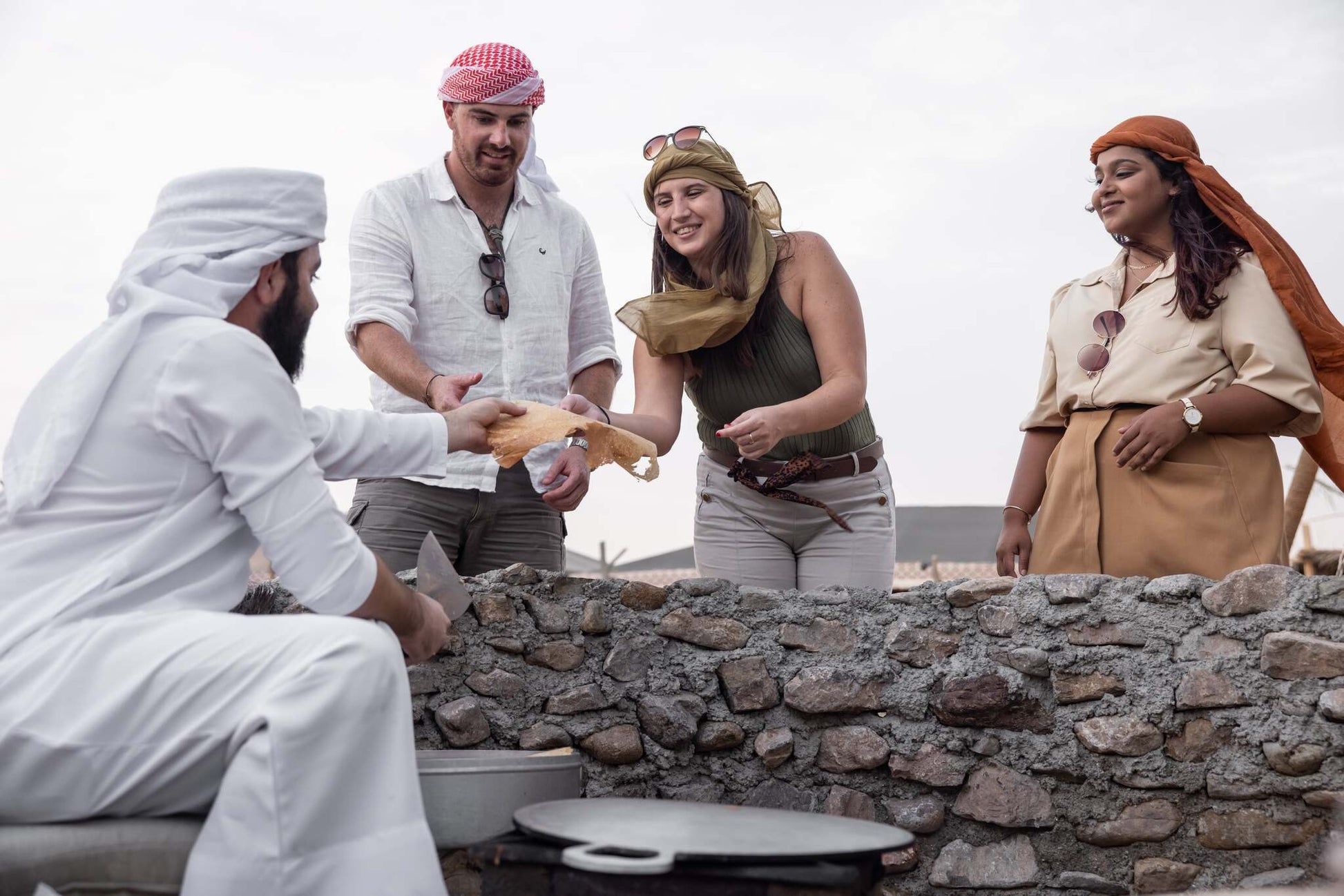 Participants learning about Emirati culture and traditions during the tour.