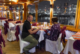 Couple having dinner in Dhow Cruise