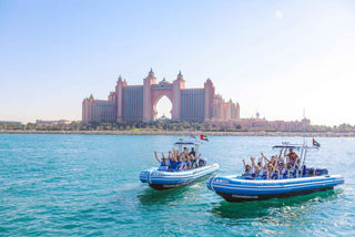 speedboats on the water with the iconic Atlantis, The Palm resort in Dubai
