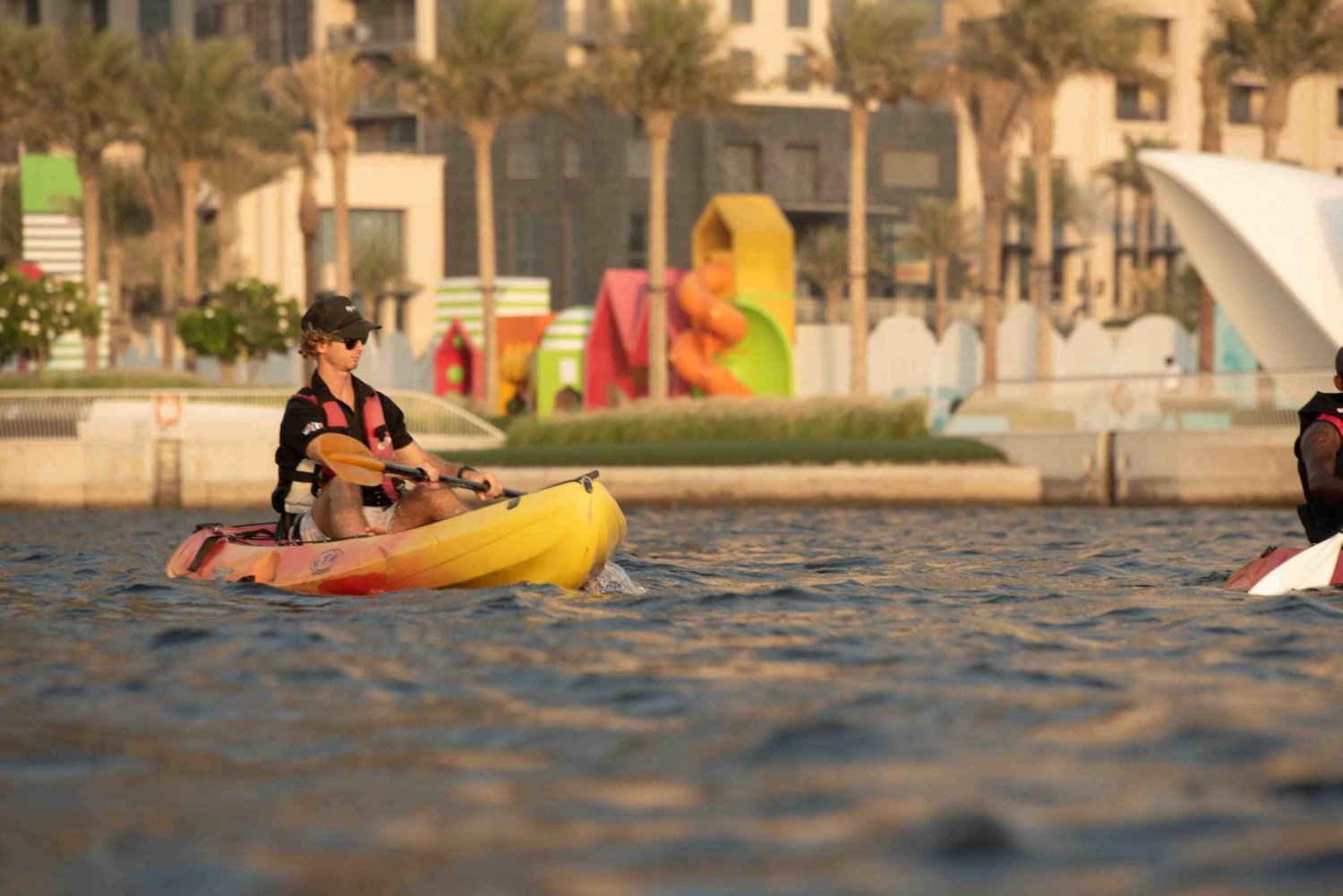 Boy Kayaking in Marina