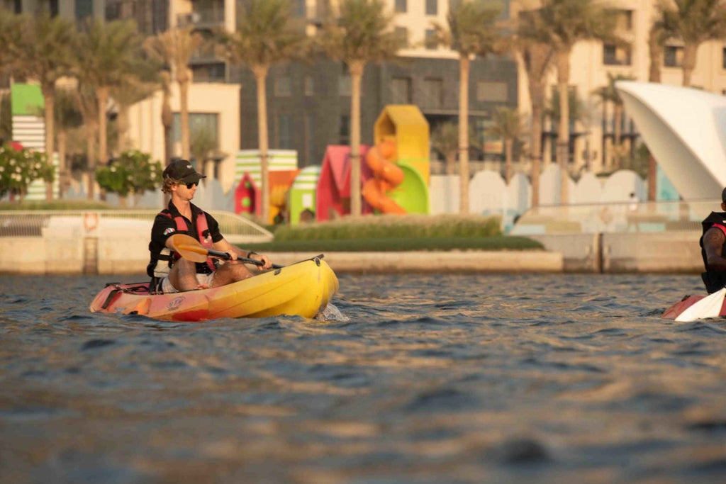 Boy Kayaking in Marina
