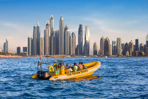 The Yellow Boats conducting a sightseeing tour with the Dubai Marina skyline